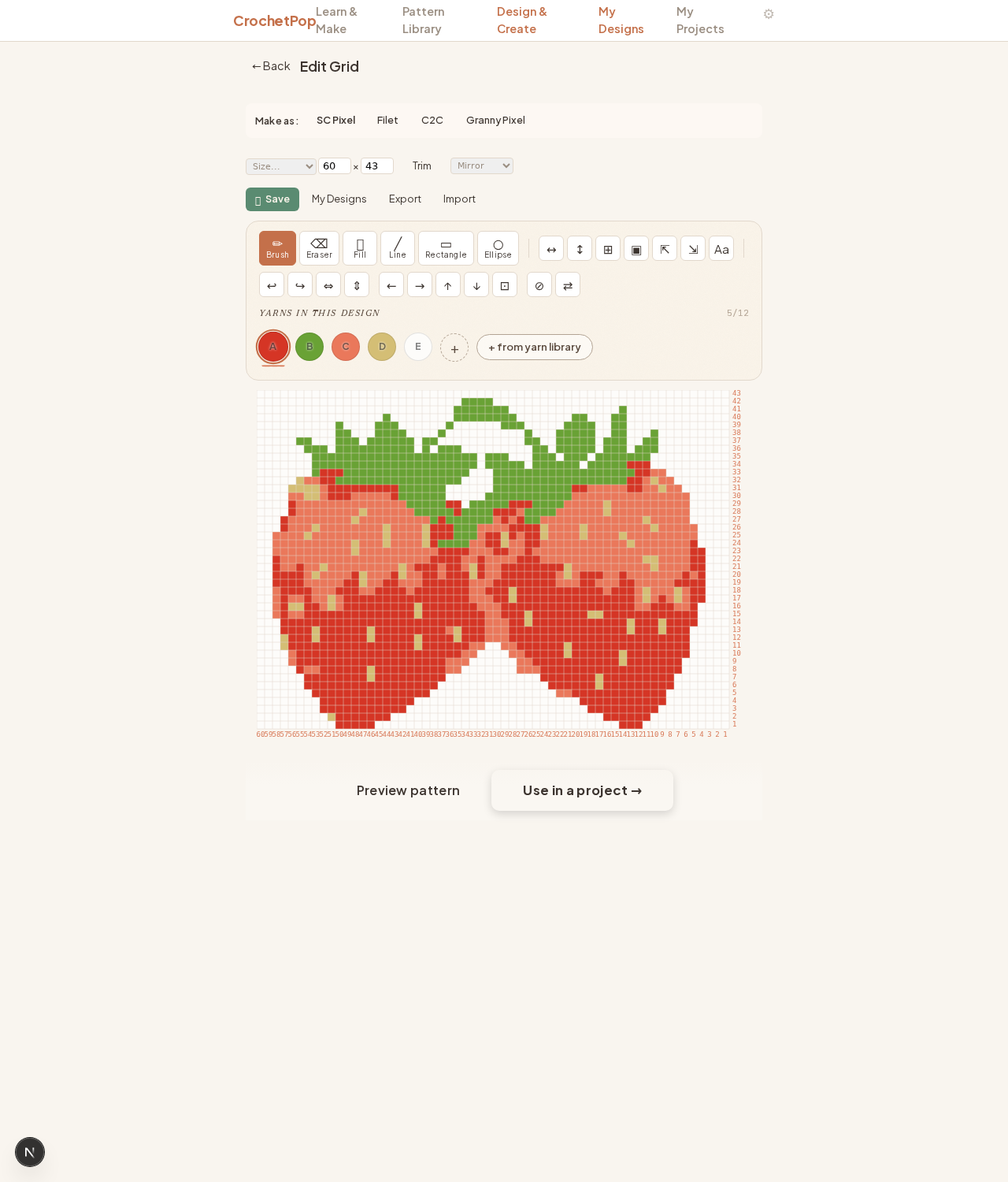 Design Studio editor with two ripe red strawberries pre-loaded — green leaves on top, detailed seed pattern, 43×60 grid, 5 yarn colors (Hot Red, Sage, Carrot, Buff, White), SC Pixel technique pre-selected